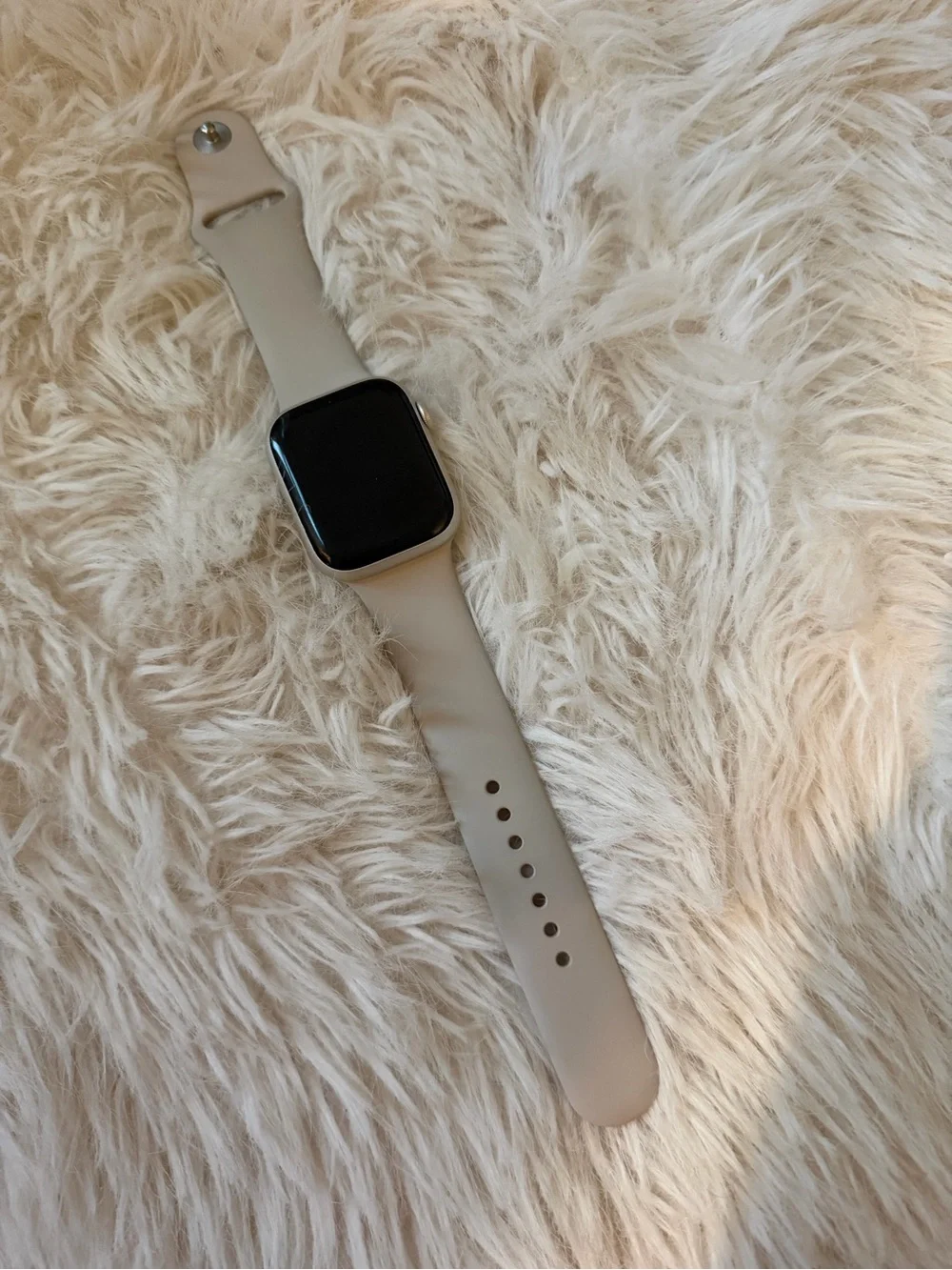 Silver Apple Watch with Light Gray Silicone Band